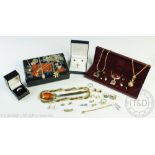 A collection of costume jewellery to a box to include gold plated jewellery, necklaces, chains,