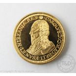 A replica (reduced size) of a Charles I gold five unites,