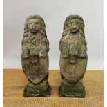 A pair of reconstituted stone rampant heraldic lions,