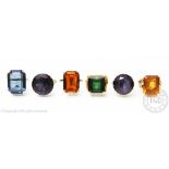 A selection of five dress rings, each set with a different large synthetic stone,