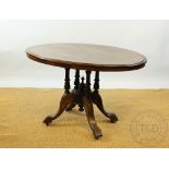 A Victorian walnut oval loo table, on carved outswept legs, 72cm H x 116cm W.