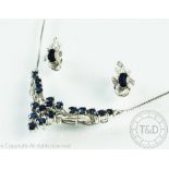 A diamond and untested sapphire set suite of jewellery, comprising necklace and earrings,