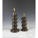 A near pair of oak lamps, each of barley twist form and upon turned circular bases,