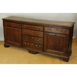 A George III dresser oak and mahogany crossbanded dresser,