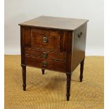 A Regency mahogany bedside cabinet with cupboard door, real drawer and faux drawer,