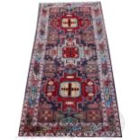 A Caucasian wool runner, of wide proportions, with three geometric gulls against a blue ground,