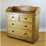 A Victorian style pine chest, with three quarter raised back above two long and two short drawers,