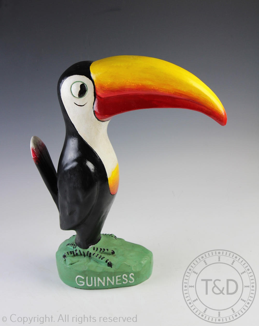 A vintage novelty advertising Guinness model of a toucan,