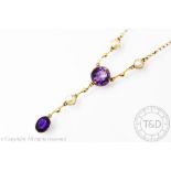 An Edwardian amethyst and split seed pearl set lavalier necklace,