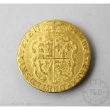 A George III gold Guinea coin dated 1784 (marked to rim from old mount), gross weight 8.