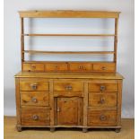 A Victorian pine country kitchen dresser, with two shelves and four short drawers,