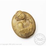 A 19th century lava cameo brooch, depicting a classical maiden in high relief and within gold mount,