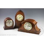 An Edwardian mahogany lancet shaped clock by WM.L.