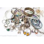 An assorted collection of silver and silver coloured jewellery, to include; two hinged bangles,