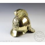 A Victorian brass Merryweather fireman helmet, with embossed and crested detailing,