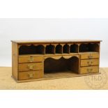 A Victorian pine stationery unit, with an arrangement of pigeon holes and drawers,