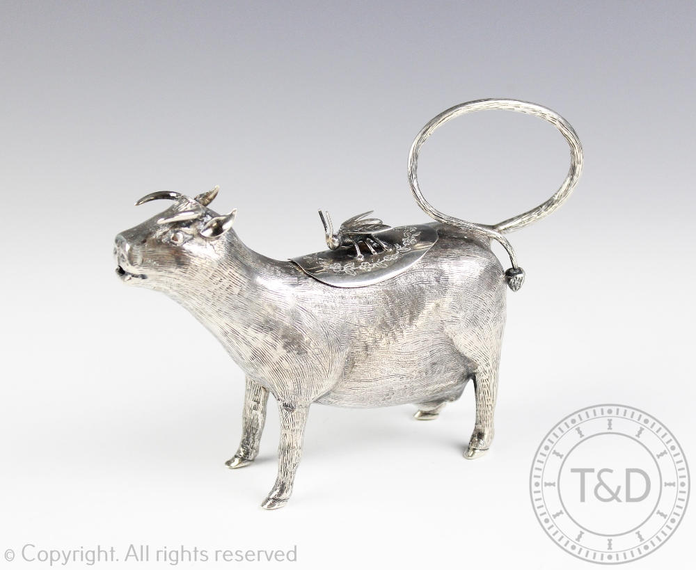 A white metal cow creamer, the beast modelled standing with textured 'fur' finish, - Image 2 of 2