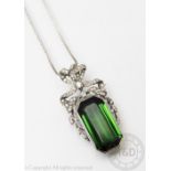 A tourmaline and diamond Belle Epoque pendant/brooch, designed as a large central,