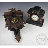 A Victorian marble eight day mantle clock, with Roman numeral dial and movement striking on a gong,