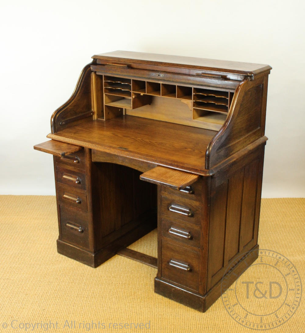 An Edwardian oak roll top desk, with tambour above an arrangement of nine drawers, on plinth base, - Image 2 of 2