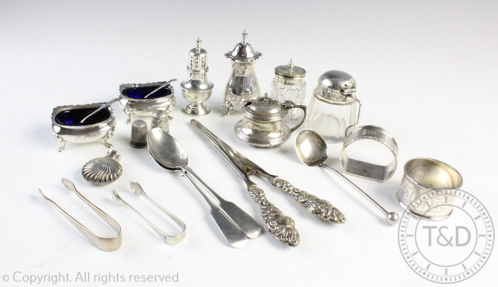 A selection of silver to include a pair of salts, a pair of silver handled glove stretchers,