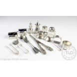 A selection of silver to include a pair of salts, a pair of silver handled glove stretchers,