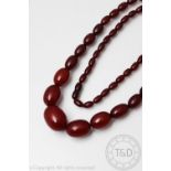 A 'cherry' amber bead necklace, the graduated beads with screw clasp, gross weight gross weight 81.