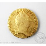 A George III gold Guinea coin dated 1788 (marked to rim from old mount), gross weight 8.