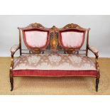 A late Victorian seven piece salon suite, rosewood and satinwood inlaid with pink floral upholstery,