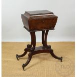 A William IV mahogany work table, with hinged top and base drawer, on replacement stand,