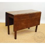 A George III oak drop leaf table on tapering square legs, 72cm H,