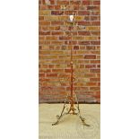An Edwardian copper and iron standard lamp, converted for electricity,