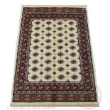 A Kashmir bokhara rug, worked with gulls against an ivory ground,