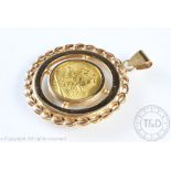 A George V gold sovereign dated 1925, within yellow metal pendant surround stamped '750',