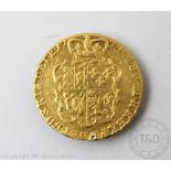 A George III gold Guinea coin dated 1774 (marked to rim from old mount), gross weight 8.
