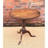 A George III oak circular occasional table with four piece top,