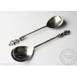 A pair of silver Apostle type spoons, Elkington and Co, Birmingham 1909, each with figural terminal,