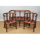 An Edwardian mahogany salon suite, comprising a settee and a pair of chairs,