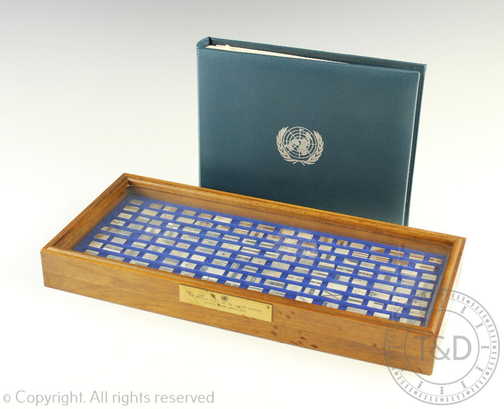 A cased set of Franklin Mint 'The official flags of the United Nations' minted silver miniatures,