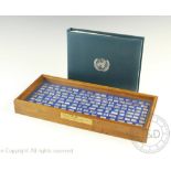 A cased set of Franklin Mint 'The official flags of the United Nations' minted silver miniatures,