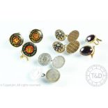A collection of assorted cufflinks,