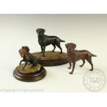 Three Country Artists models of dogs comprising; Black Labrador,