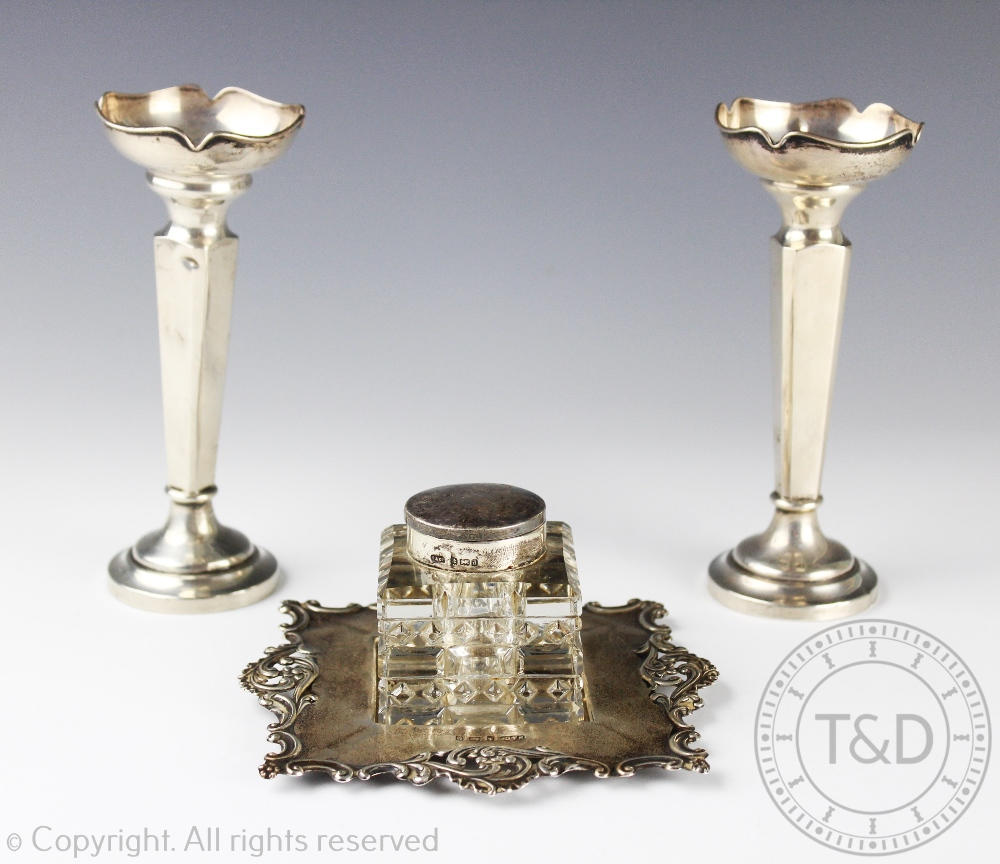 A pair of George V silver posy vases, each with cusped rims and canted square, 15.