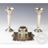 A pair of George V silver posy vases, each with cusped rims and canted square, 15.