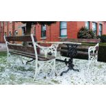 A set of cast garden furniture, comprising a pair of benches and a table in the Coalbrookdale style,