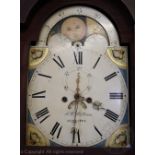 A George III oak cased eight day long case clock, the arched dial with painted rolling moon phase,