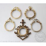 Five gold coin mounts, to include; three plain 9ct gold examples, gross weight 4.