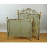 A French bed, late 19th century, painted in grey with carved details,