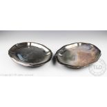 A pair of silver plated food warming dishes, 19th century, of oval cusped form,