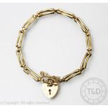 A deliate 9ct gold gate bracelet, designed as ten two bar links,